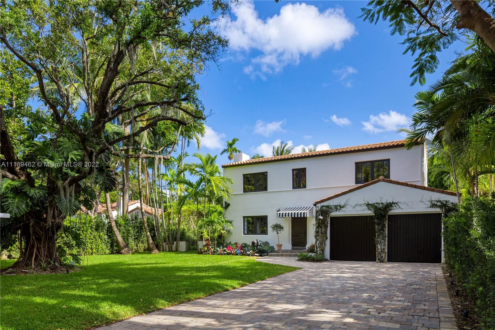 Mediterranean-style Miami estate exterior with documented code-compliant roofing and impact-rated openings