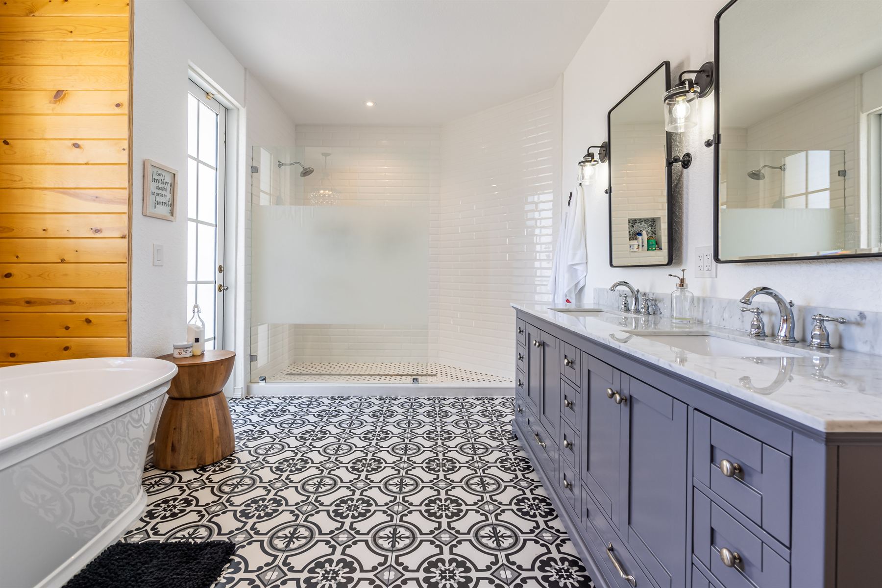 Licensed bathroom remodel in Miami-Dade with freestanding marble tub and properly waterproofed wet area